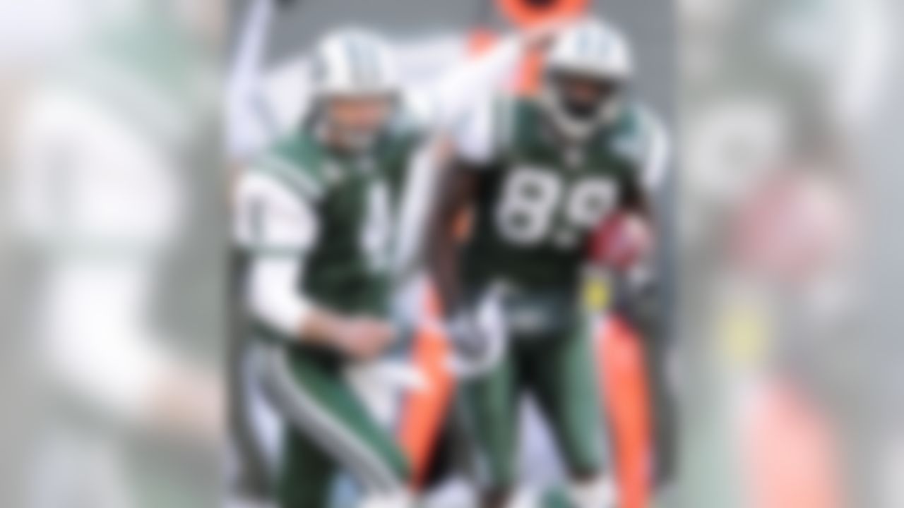 New York Jets quarterback Brett Favre, left, congratulates teammate Jerricho Cotchery after he scored a touchdown during the first quarter of an NFL football game Sunday, Dec. 14, 2008, at Giants Stadium in East Rutherford, N.J. (AP Photo/Bill Kostroun)