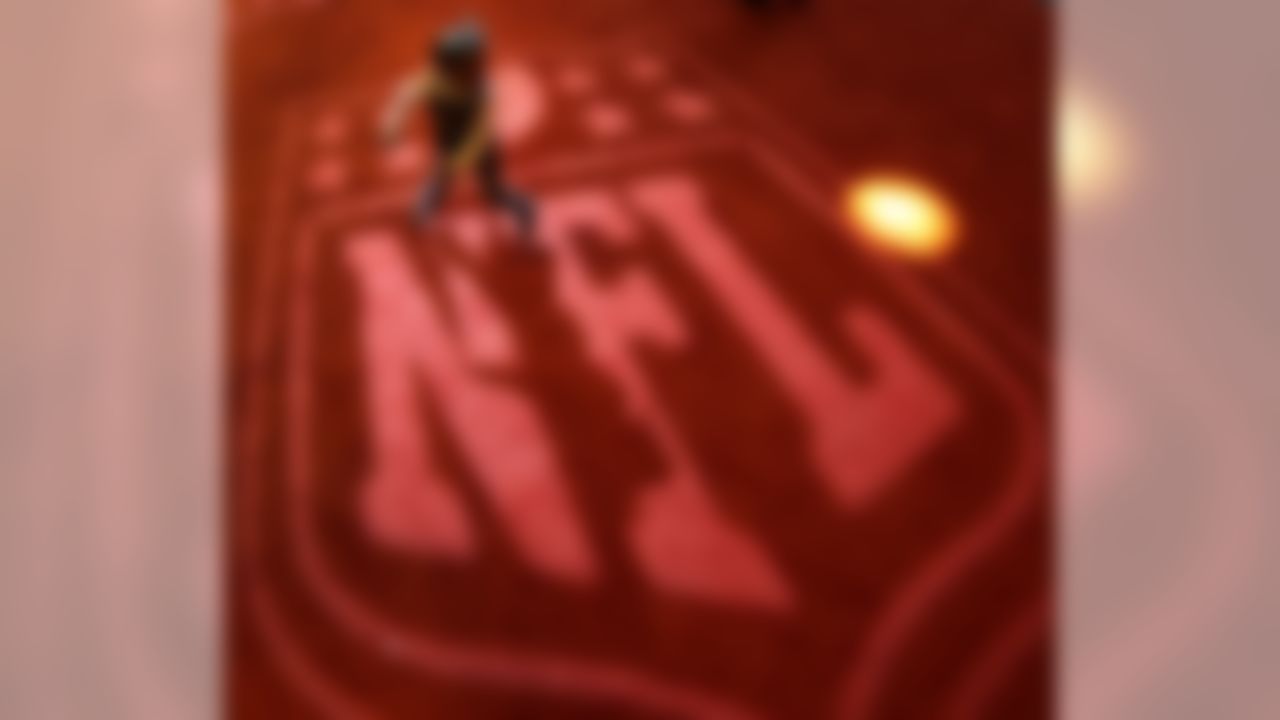 Four-year-old Angelina Knox, from New Orleans, dances on an NFL logo at the NFL experience Wednesday, Jan. 30, 2013, in New Orleans. The city will host the Super Bowl XLVII football game Sunday. (AP Photo/Charlie Riedel)