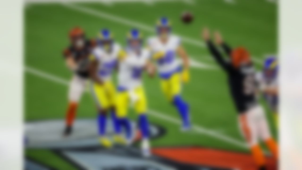 Los Angeles Rams quarterback Matthew Stafford (9) throws the ball as Cincinnati Bengals defensive end Trey Hendrickson (91) tries to deflect the pass during Super Bowl LVI on Sunday, February 13, 2022 in Inglewood, California.