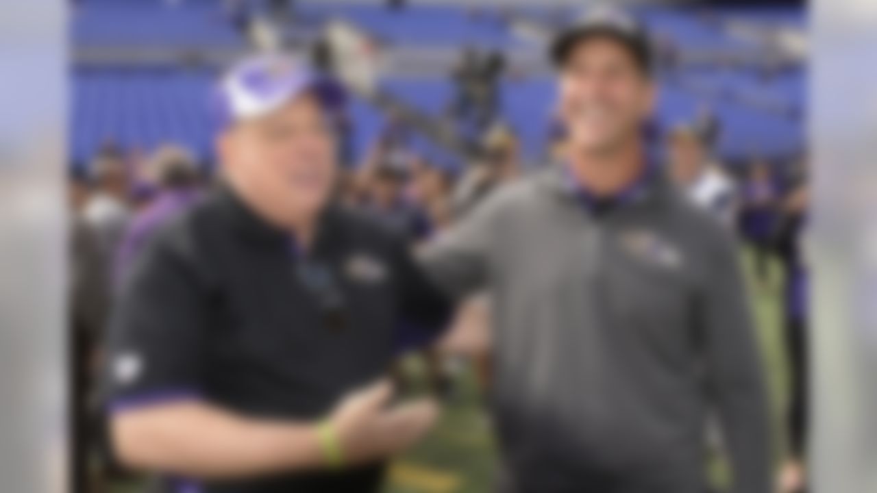 Gov. Larry Hogan, R-Md., greets Baltimore Ravens head coach John Harbaugh along the sidelines before an NFL football game against the Cincinnati Bengals in Baltimore, Sunday, Sept. 27, 2015. (AP Photo/Nick Wass)