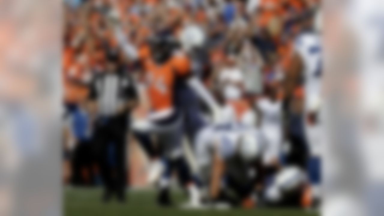 Denver Broncos outside linebacker DeMarcus Ware, left, celebrates after sacking Indianapolis Colts quarterback Andrew Luck during the first half in a NFL football game, Sunday, Sept. 18, 2016, in Denver. (AP Photo/Jack Dempsey)