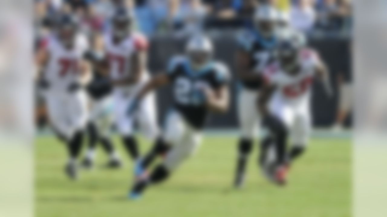 Carolina Panthers' Jonathan Stewart (28) runs past Atlanta Falcons players in the first half of an NFL football game in Charlotte, N.C., Sunday, Dec. 13, 2015. (AP Photo/Mike McCarn)