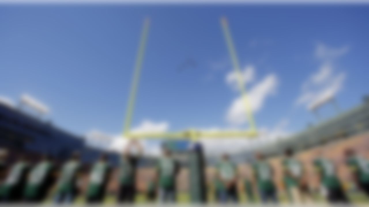 Planes fly over Lambeau Field after the national anthem before an NFL football game between the Green Bay Packers and the San Francisco 49ers Sunday, Sept. 9, 2012, in Green Bay, Wis. (AP Photo/Jeffrey Phelps)