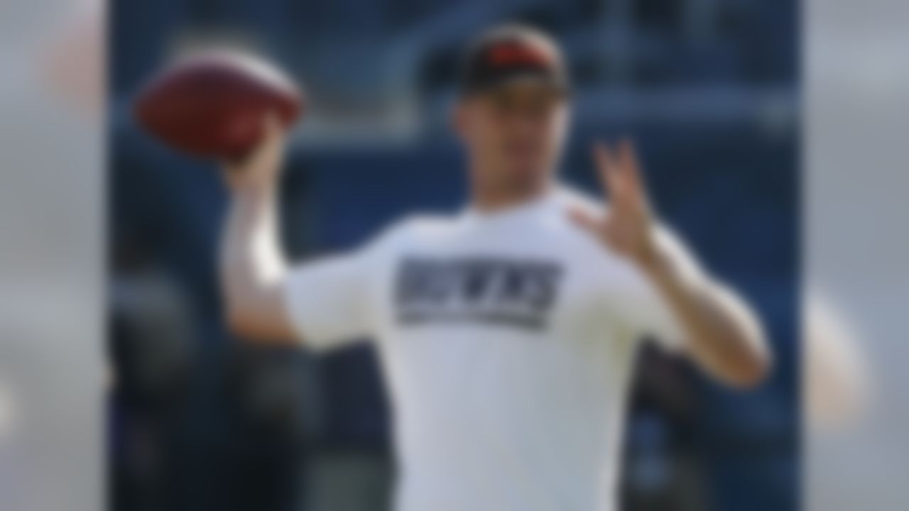 Cleveland Browns quarterback Brandon Weeden passes during warmups before a preseason NFL football game against the Chicago Bears, Thursday, Aug. 29, 2013, in Chicago. (AP Photo/Charles Rex Arbogast)