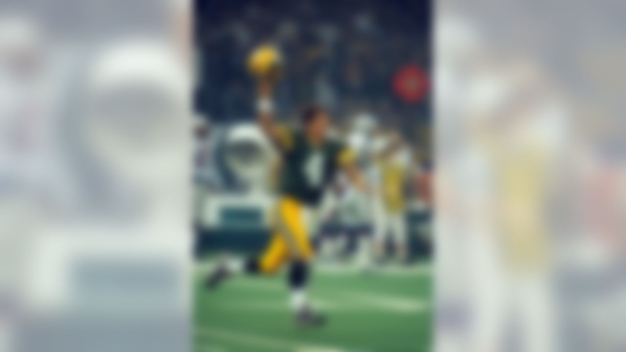 Green Bay Packers quarterback Brett Favre celebrates after throwing a 29-yard touchdown pass to wide receiver Andre Rison (not pictured) during the Super Bowl XXXI against the New England Patriots played on January 26, 1997 at the Louisiana Superdome in New Orleans. (AP Photo/Tom DiPace)