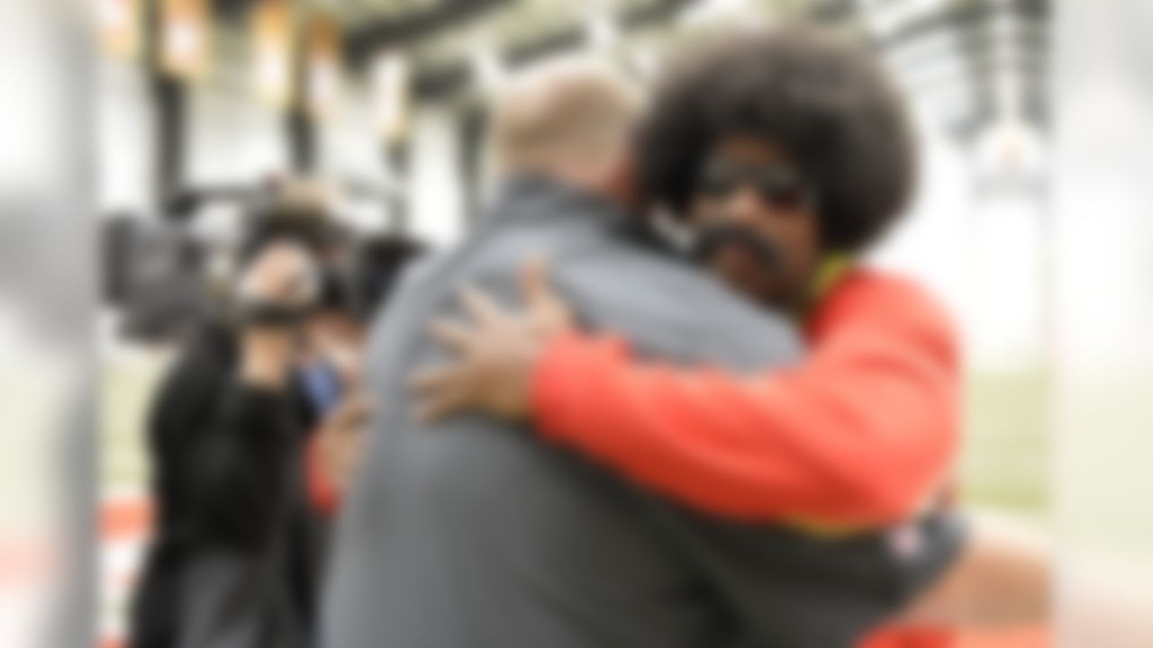 Leon Sandcastle talks with Kansas City Chiefs head coach Andy Reid on Thursday, March 28th at the University of Kansas Hospital Training Complex in Kansas City, Mo. (G. Newman Lowrance/AP Images for NFL Network)