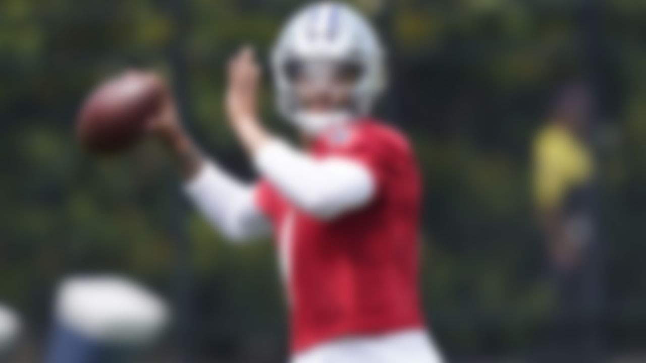 Dallas Cowboys quarterback Dak Prescott looks to pass during an NFL football team practice Tuesday, June 8, 2021, in Frisco, Texas.