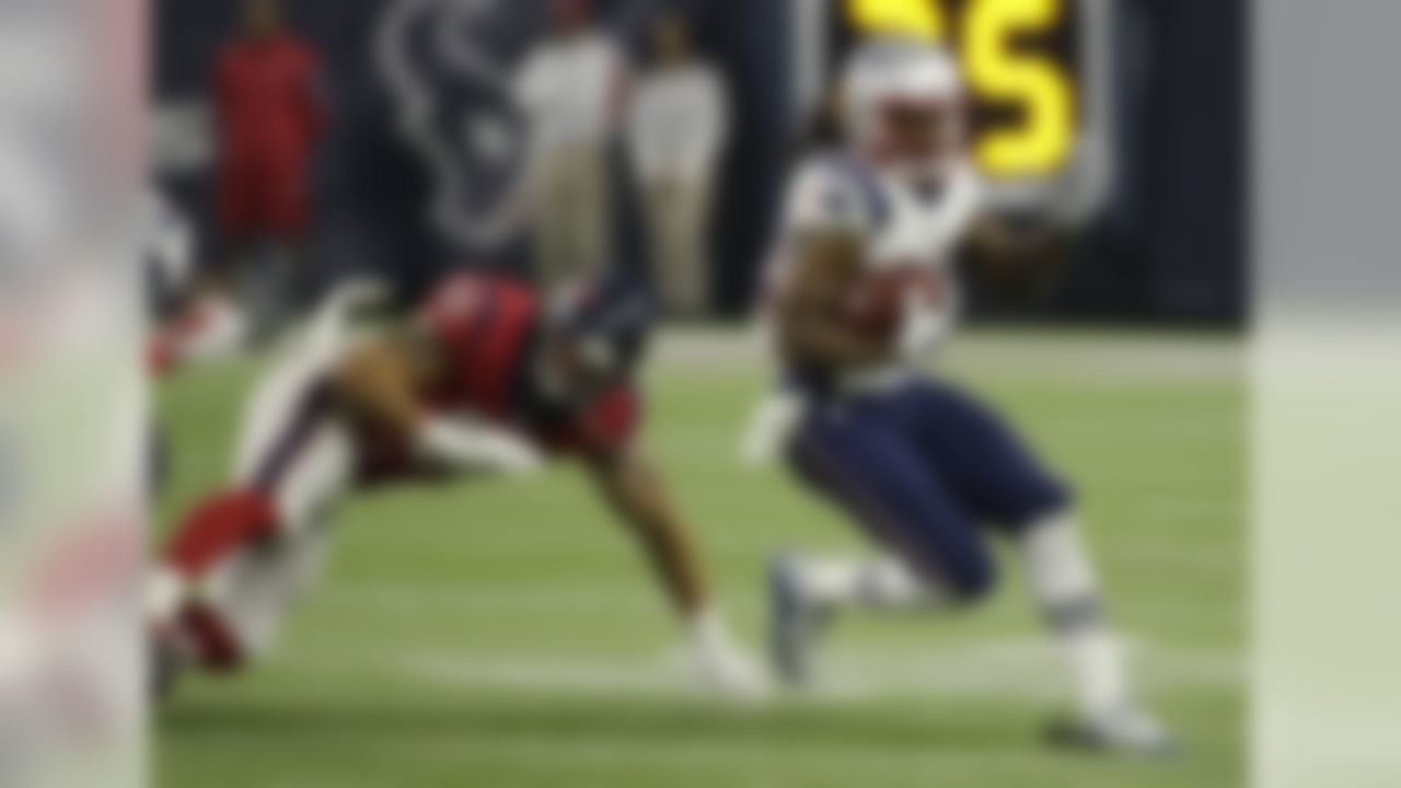 New England Patriots wide receiver Josh Boyce (82) runs around Houston Texans outside linebacker John Simon (51) during the first half of an NFL football game, Sunday, Dec. 13, 2015, in Houston. (AP Photo/David J. Phillip)