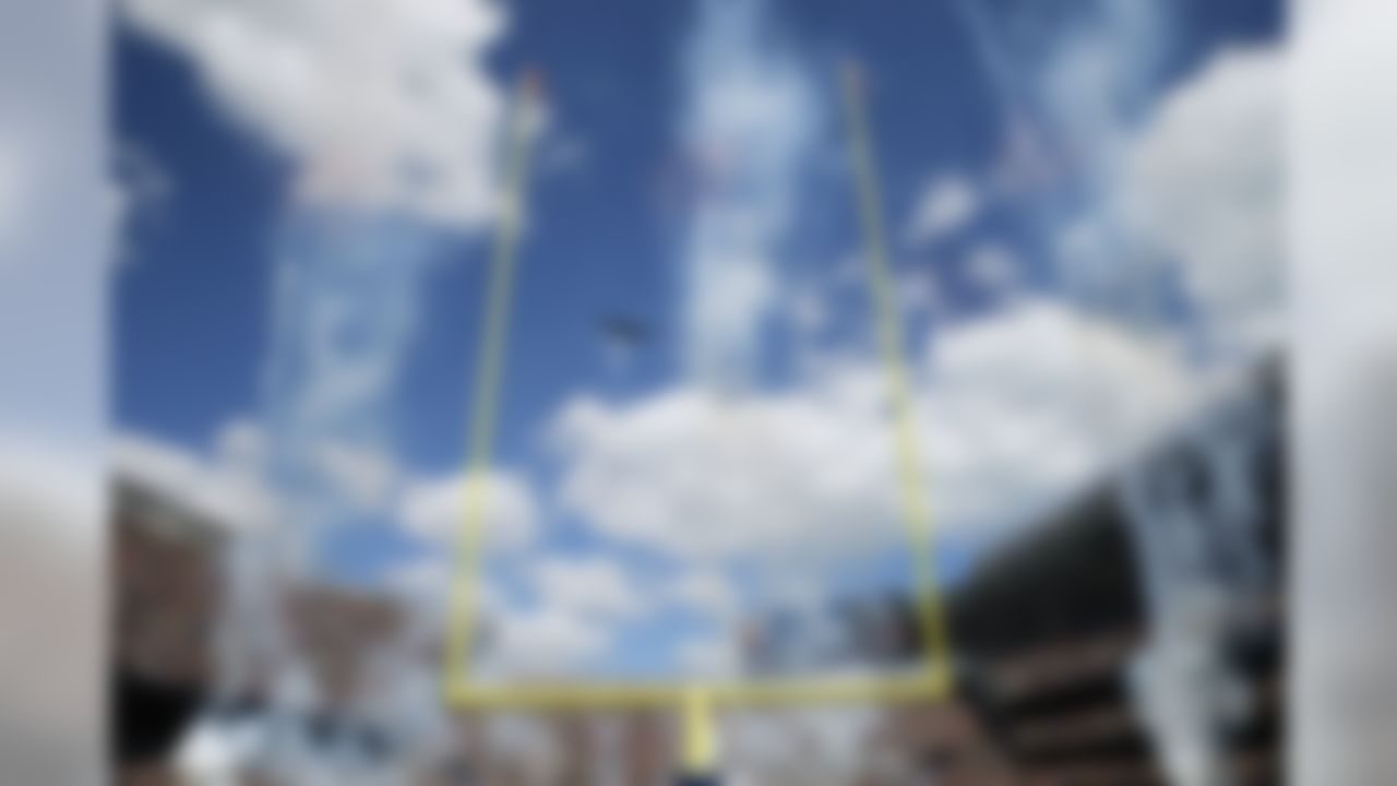 A Stealth B1 bomber flies over during pregame ceremonies before an NFL football game between the Chicago Bears and Green Bay Packers  Sunday, Sept. 13, 2015, in Chicago. (AP Photo/Charles Rex Arbogast)