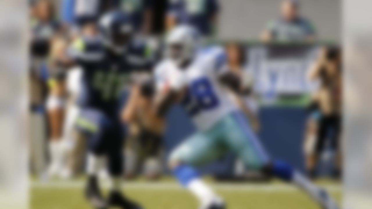 Dallas Cowboys' Felix Jones (28) rushes as Seattle Seahawks' Byron Maxwell defends in the first half of an NFL football game on Sunday, Sept. 16, 2012, in Seattle. (AP Photo/John Froschauer)