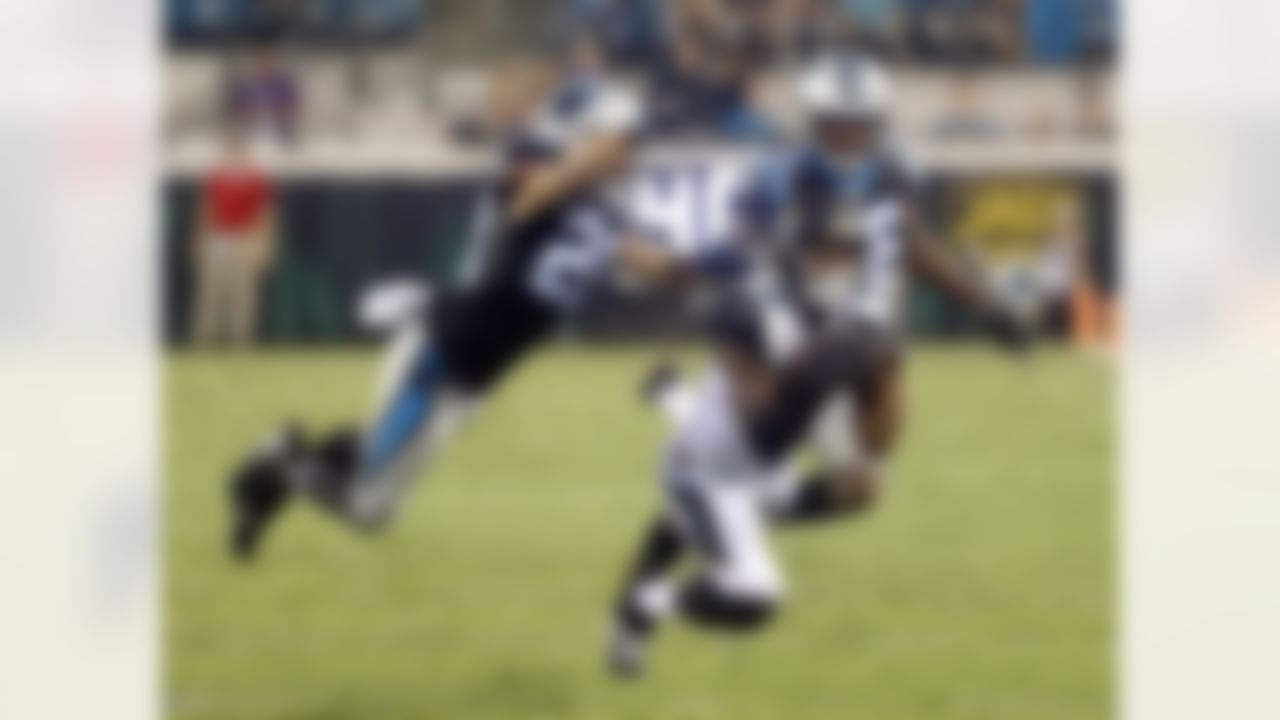 Jacksonville Jaguars wide receiver Allen Robinson (15) makes a catch against Carolina Panthers safety Kurt Coleman, left, and cornerback Daryl Worley during the first half of an NFL preseason football game, Thursday, Aug. 24, 2017, in Jacksonville, Fla. (AP Photo/Stephen B. Morton)