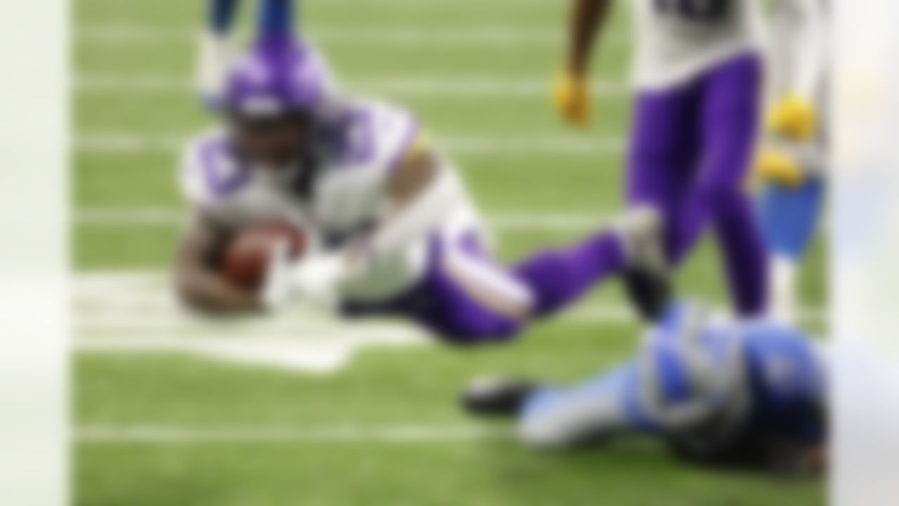 Minnesota Vikings running back Mike Boone (23) dives for an extra yard in the second half against the Detroit Lions during an NFL football game, Saturday, Jan. 3, 2021, in Detroit.