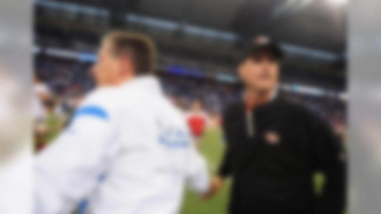 Oct 16, 2011; Detroit, OH, USA; Detroit Lions head coach Jim Schwartz (left) shakes hands with San Francisco 49ers head coach Jim Harbaugh at the end of the game at Ford Field. San Francisco 49ers defatted Detroit Lions 25-19. Mandatory Credit: Andrew Weber- US PRESSWIRE