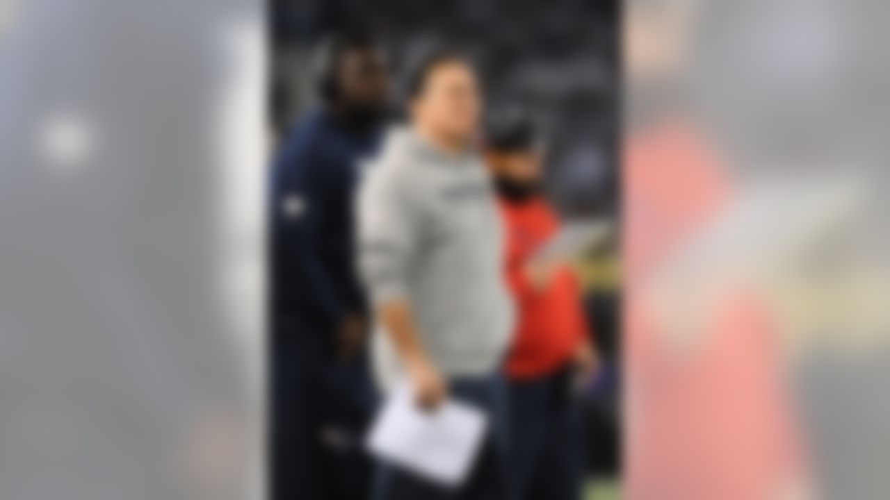 New England Patriots head coach Bill Belichick stands on the sideline in the first half of an NFL football game against the Baltimore Ravens, Sunday, Dec. 22, 2013, in Baltimore. (AP Photo/Gail Burton)