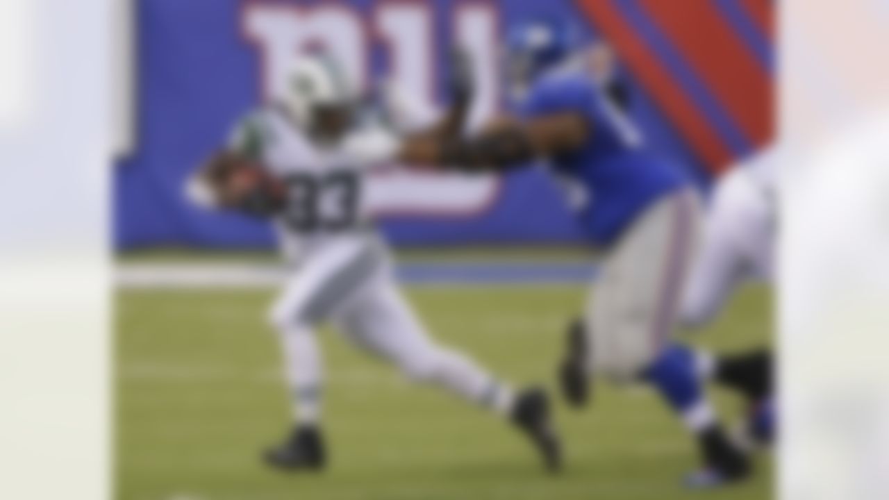 New York Jets running back Chris Ivory (33) struggles against New York Giants tackle Will Beatty (65) during the first half of a preseason NFL football game Saturday, Aug. 29, 2015, in East Rutherford, N.J. (AP Photo/Seth Wenig)