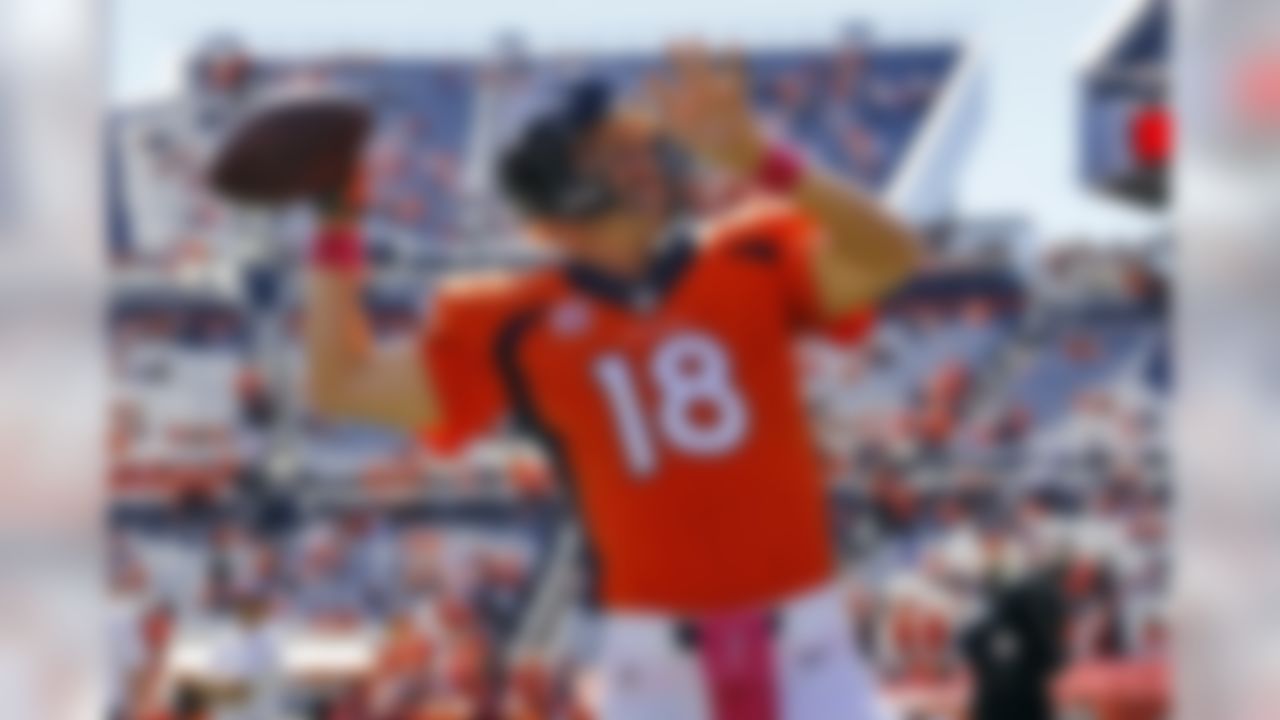 Denver Broncos quarterback Peyton Manning (18) warms up prior to an NFL football game against the Arizona Cardinals, Sunday, Oct. 5, 2014, in Denver. (AP Photo/Jack Dempsey)