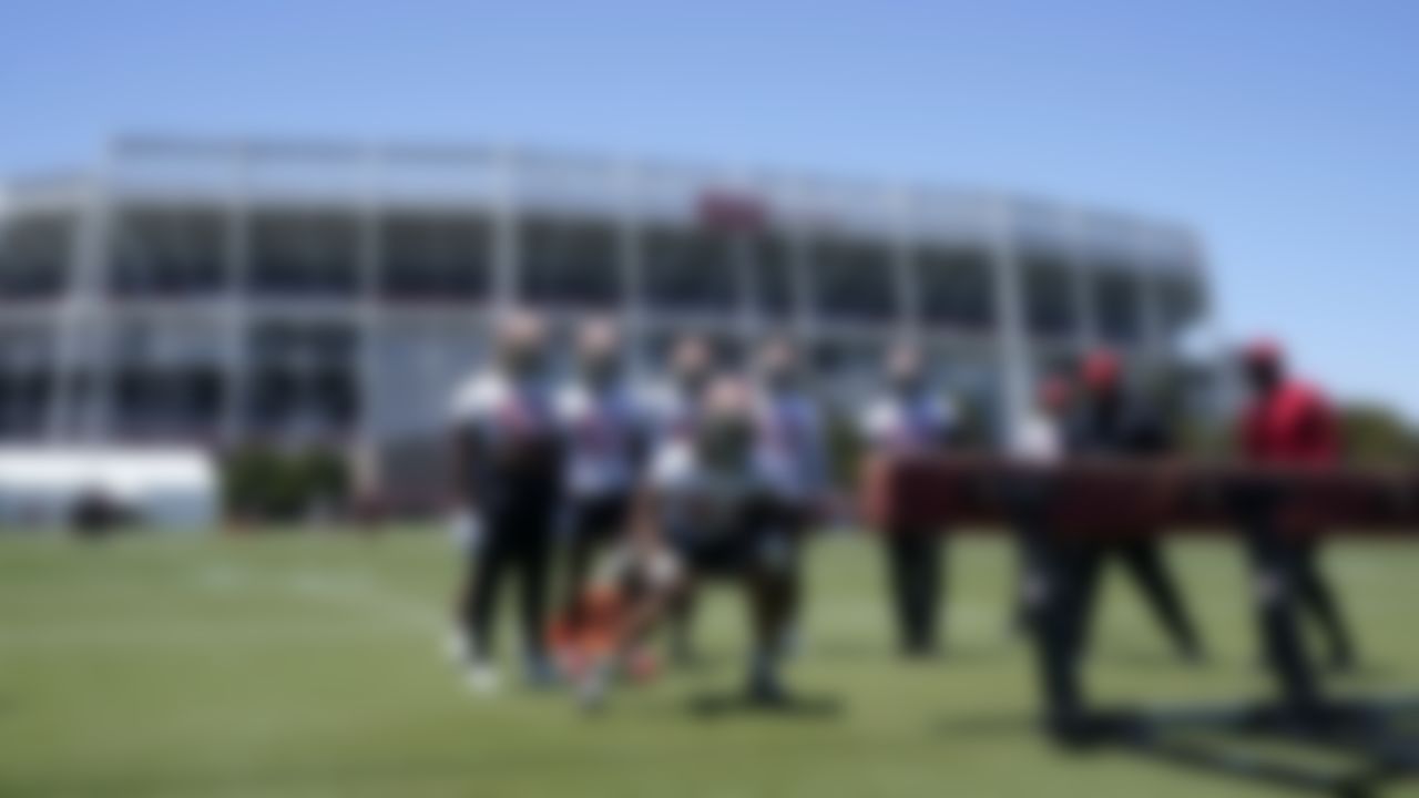 San Francisco 49ers' Fred Warner, foreground, and other linebackers perform a drill at the team's NFL football training facility in Santa Clara, Calif., Tuesday, May 25, 2021.
