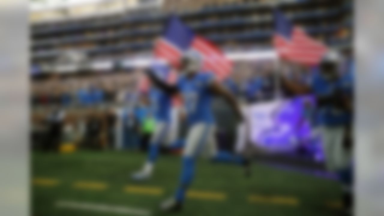 Detroit Lions quarterback Matthew Stafford (9), and free safety Glover Quin (27) run onto the field before an NFL football game against the Jacksonville Jaguars, Sunday, Nov. 20, 2016 in Detroit. (AP Photo/Paul Sancya)