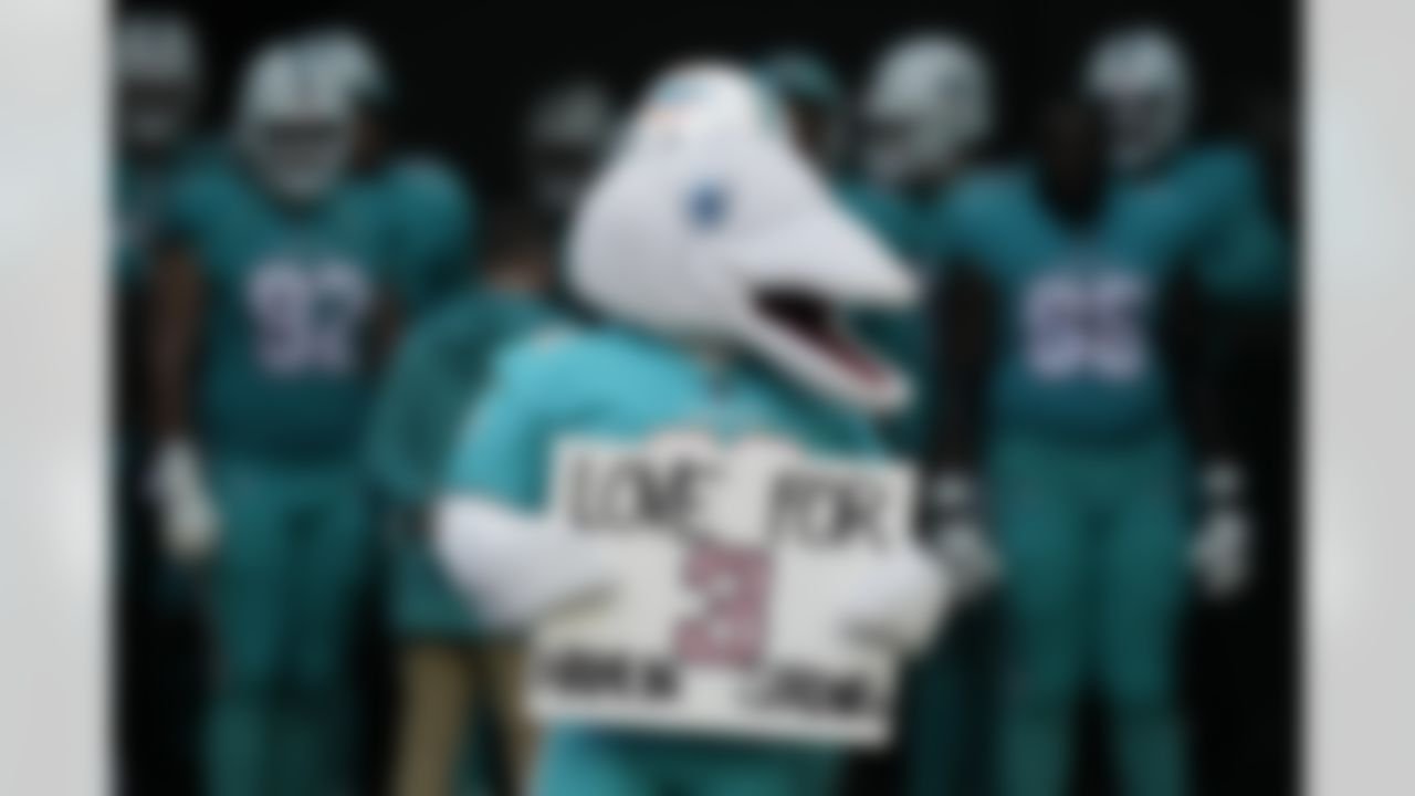 Miami Dolphins mascot TD shoes support for Buffalo Bills injured player Damar Hamlin before an NFL football game against the New York Jets, Sunday, Jan. 8, 2023, in Miami Gardens, Fla.