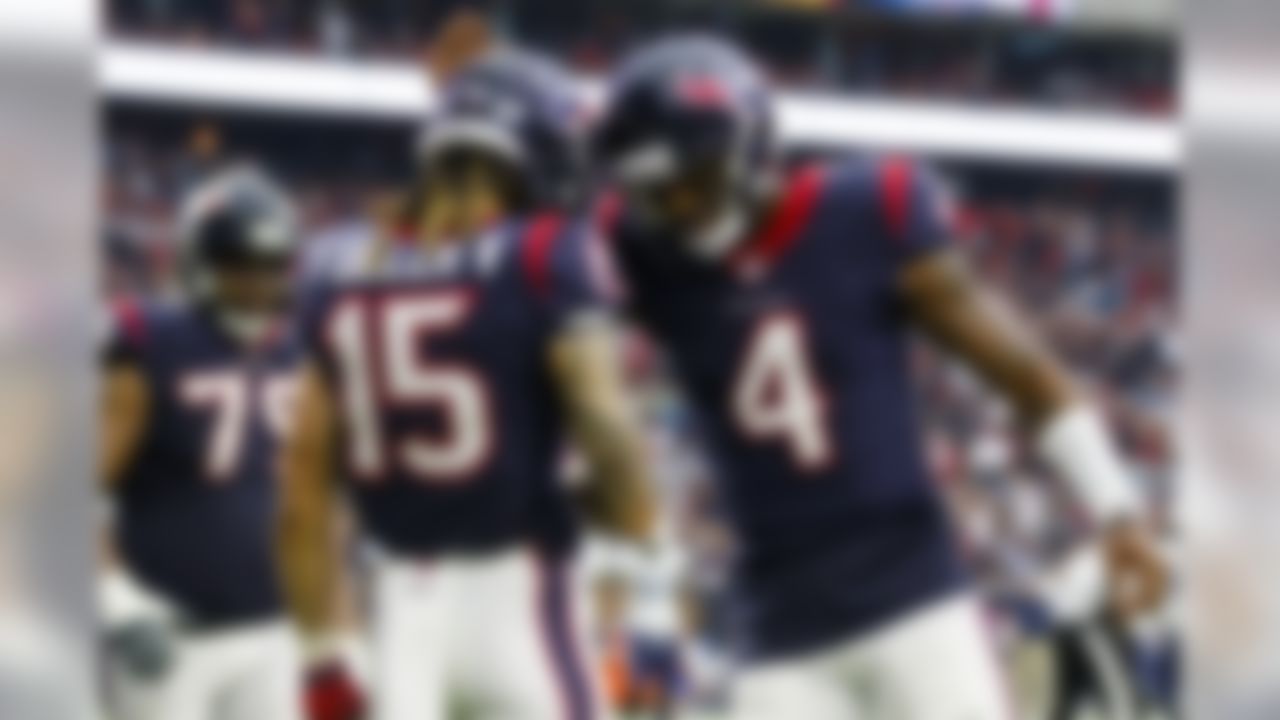 Houston Texans quarterback Deshaun Watson (4) and wide receiver Will Fuller (15) celebrate after a touchdown during an NFL football game against the Tennessee Titans, Sunday, Oct. 1, 2017, in Houston. The Texans defeated the Titans, 57-14. (Ryan Kang/NFL)