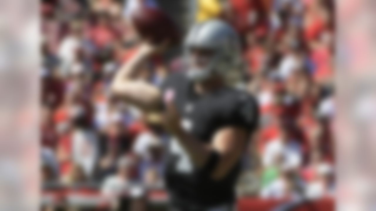 Oakland Raiders quarterback Derek Carr (4) throws a pass against the Tampa Bay Buccaneers during the first quarter of an NFL football game Sunday, Oct. 30, 2016, in Tampa, Fla. (AP Photo/Phelan Ebenhack)