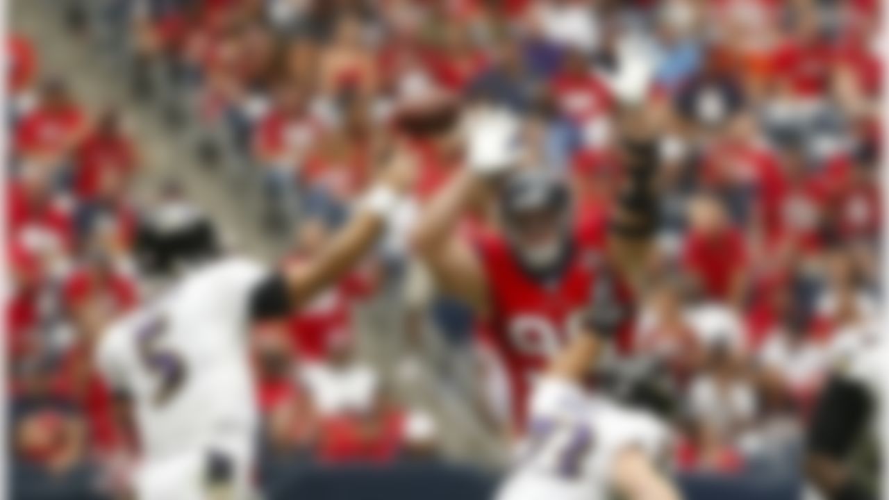 Houston Texans defensive end J.J. Watt (99) tries to deflect a pass from Baltimore Ravens quarterback Joe Flacco (5) during an NFL football game at Reliant Stadium on Sunday October 21, 2012 in Houston, Texas. Houston won 43-13. (AP Photo/Aaron M. Sprecher)