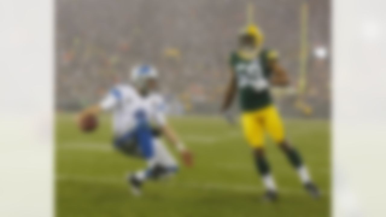 Detroit Lions' Matthew Stafford reacts after running for a touchdown against Green Bay Packers' Brad Jones (59) during the first half of an NFL football game Sunday, Dec. 9, 2012, in Green Bay, Wis. (AP Photo/Jeffrey Phelps)