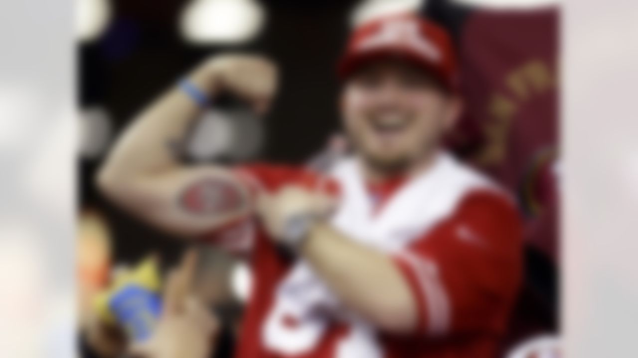 A San Francisco 49ers fan shows off his tattoo after the NFL football NFC Championship game against the Atlanta Falcons Sunday, Jan. 20, 2013, in Atlanta. The 49ers won 28-24 to advance to Super Bowl XLVII. (AP Photo/Mark Humphrey)