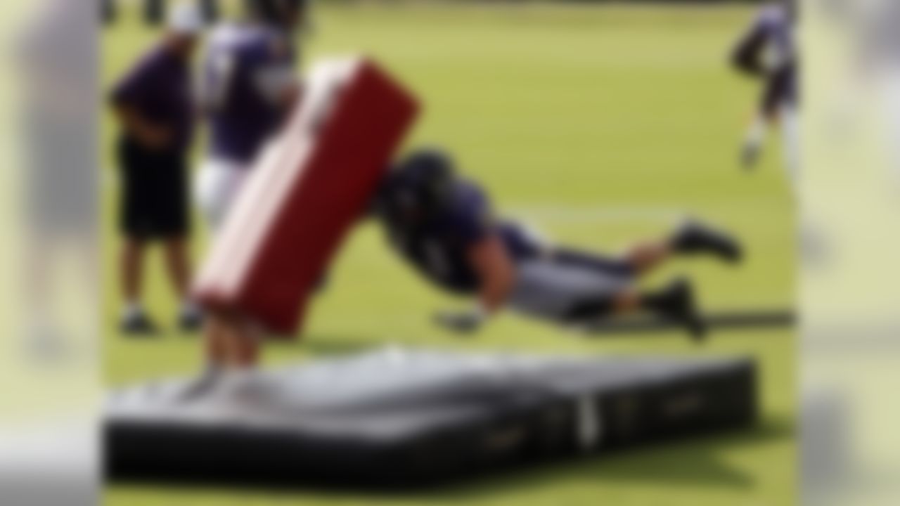 Baltimore Ravens guard Marshal Yanda dives onto a pad while running a drill during NFL football training camp in Owings Mills, Md., Thursday, Aug. 4, 2011. (AP Photo/Patrick Semansky)