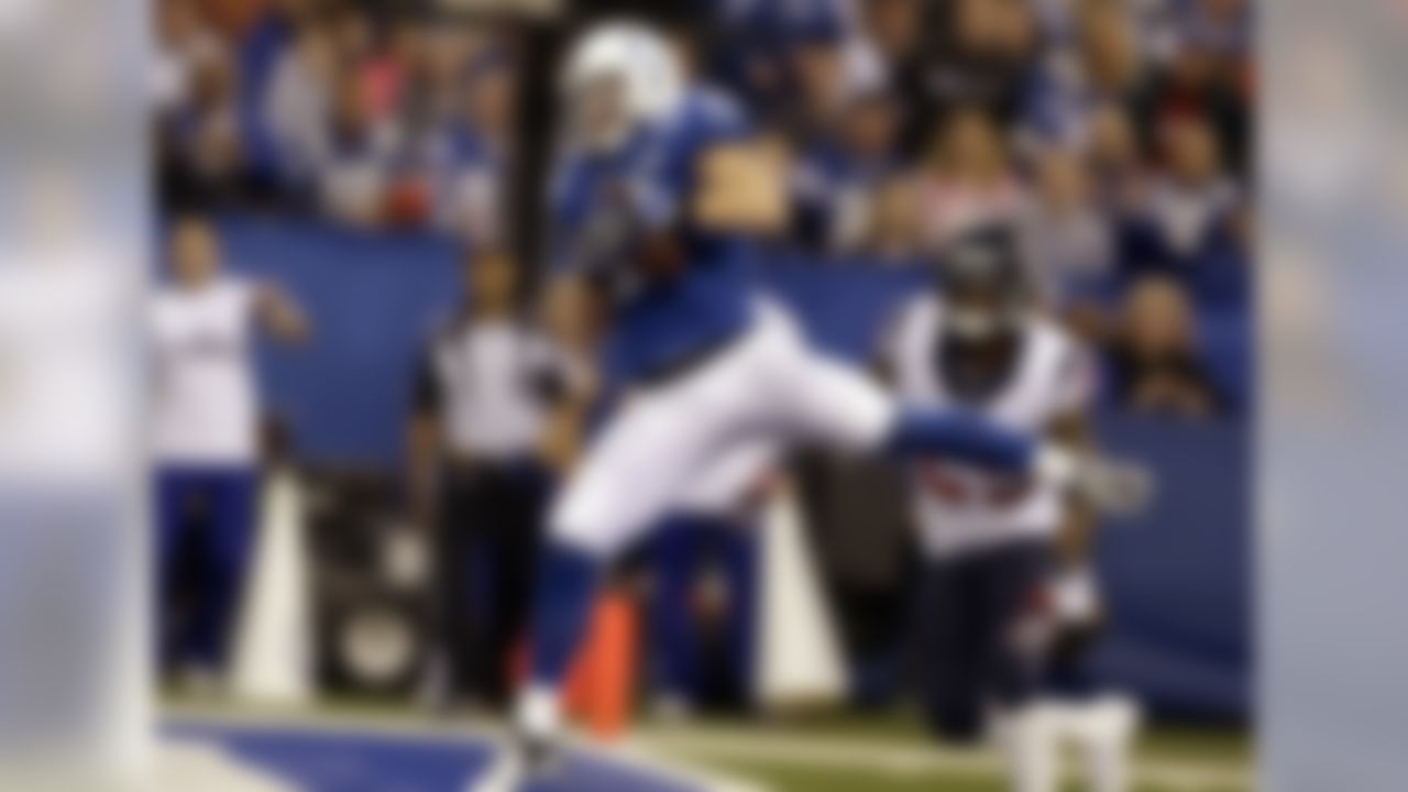 Indianapolis Colts receiver Griff Whalen makes a catch for a touchdown in front of Houston Texans cornerback Kareem Jackson during the first half of an NFL football game in Indianapolis, Sunday, Dec. 15, 2013. (AP Photo/Darron Cummings)