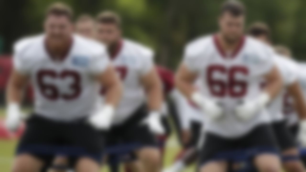 Washington Football Team's Beau Benzschawel (63) and David Steinmetz (66) warm up during an NFL football OTA at Inova Sports Performance Center in Ashburn, Va., Wednesday, June 2, 2021.