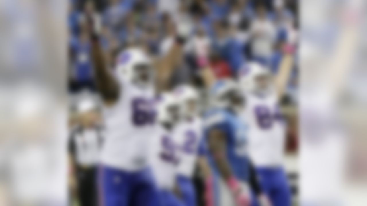 Buffalo Bills tackle Seantrel Henderson (66) celebrates as he watches a 58 -yard game-winning field goal in the fourth quarter of an NFL football game against the Detroit Lions Sunday, Oct. 5, 2014, in Detroit. The Bills defeated the Lions 17-14.(AP Photo/Duane Burleson)