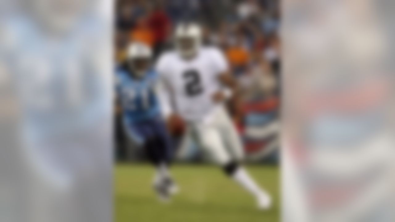 NASHVILLE, TN - AUGUST 15:  JaMarcus Russell #2 of the Oakland Raiders runs with the ball against Reynaldo Hill #21 of the Tennessee Titans during the NFL pre-season game at LP Field August 15, 2008 in Nashville, Tennessee.  (Photo by Andy Lyons/Getty Images)