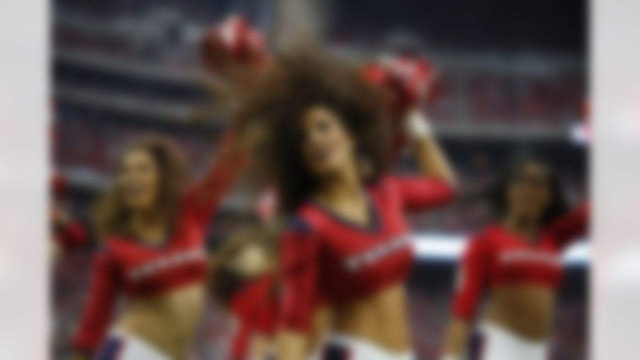 The Houston Texans cheerleaders perform during the second quarter of an NFL football game, Sunday, Nov. 2, 2014, in Houston. (AP Photo/Tony Gutierrez)