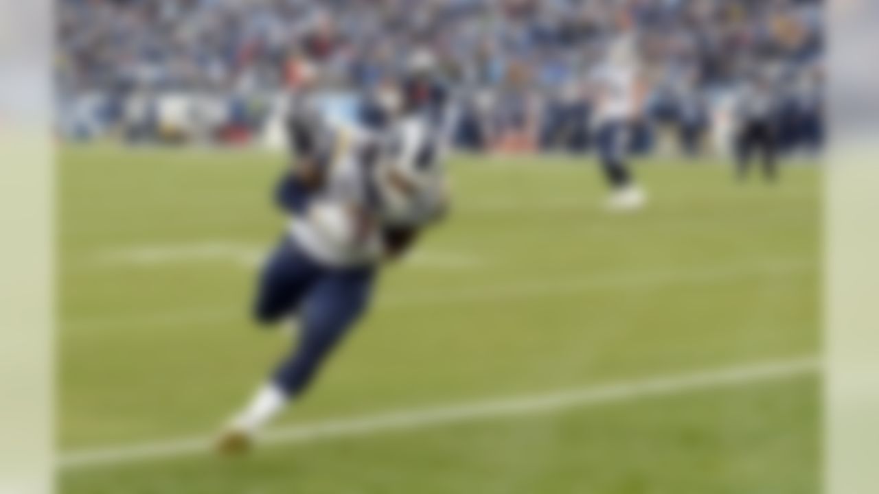 Los Angeles Rams running back Todd Gurley (30) scores a touchdown on an 11-yard pass reception against the Tennessee Titans in the first half of an NFL football game Sunday, Dec. 24, 2017, in Nashville, Tenn. (AP Photo/Mark Zaleski)