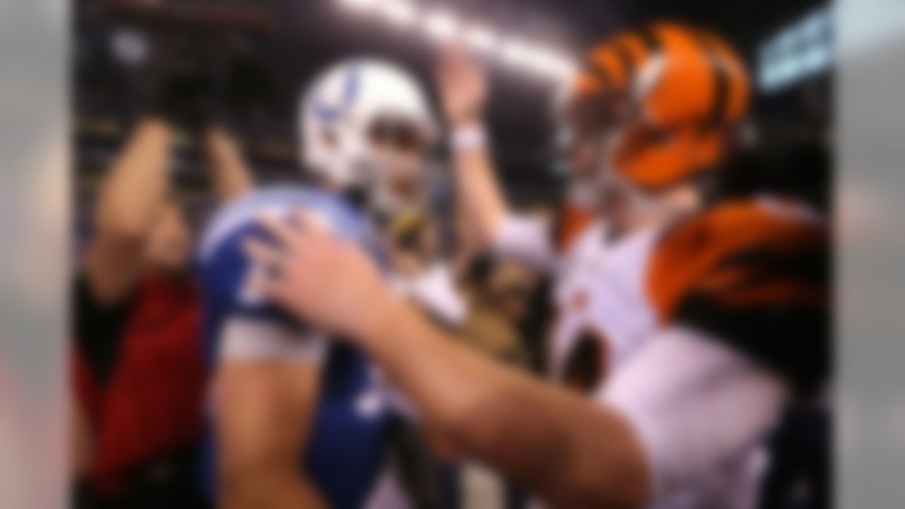 Indianapolis Colts quarterback Andrew Luck (12) and Cincinnati Bengals quarterback Andy Dalton (14) talk after an AFC Wild Card football game at Lucas Oil Stadium on Sunday, January 4, 2015 in Indianapolis. The Colts defeated the Bengals 26-10. (Perry Knotts/NFL)