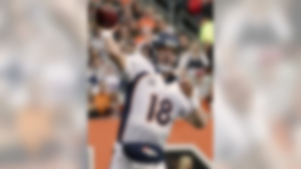 Denver Broncos quarterback Peyton Manning passes against the Cincinnati Bengals in the first half of an NFL football game, Sunday, Nov. 4, 2012, in Cincinnati. (AP Photo/Michael Keating)