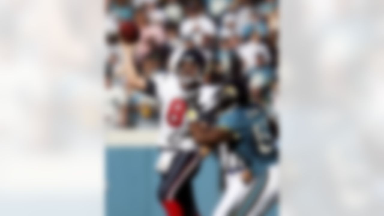 JACKSONVILLE, FL - NOVEMBER 12:  Quarterback David Carr #8 of the Houston Texans is hit while throwing a pass by linebacker Daryl Smith #52 of the Jacksonville Jaguars on November 12, 2006 at Alltel Stadium in Jacksonville, Florida. The Texans defeated the Jaguars 13-10. Photo by Getty Images.