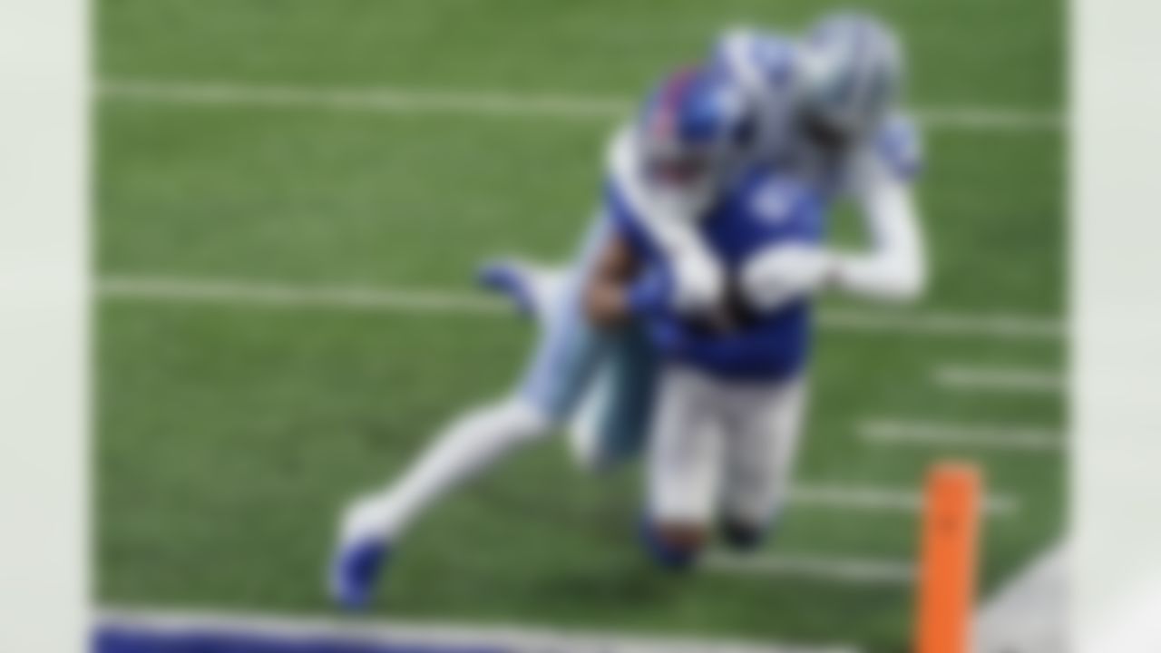 New York Giants' Sterling Shepard, left, scores a touchdown as Dallas Cowboys' Trevon Diggs tries to stop him during the first half of an NFL football game, Sunday, Jan. 3, 2021, in East Rutherford, N.J.