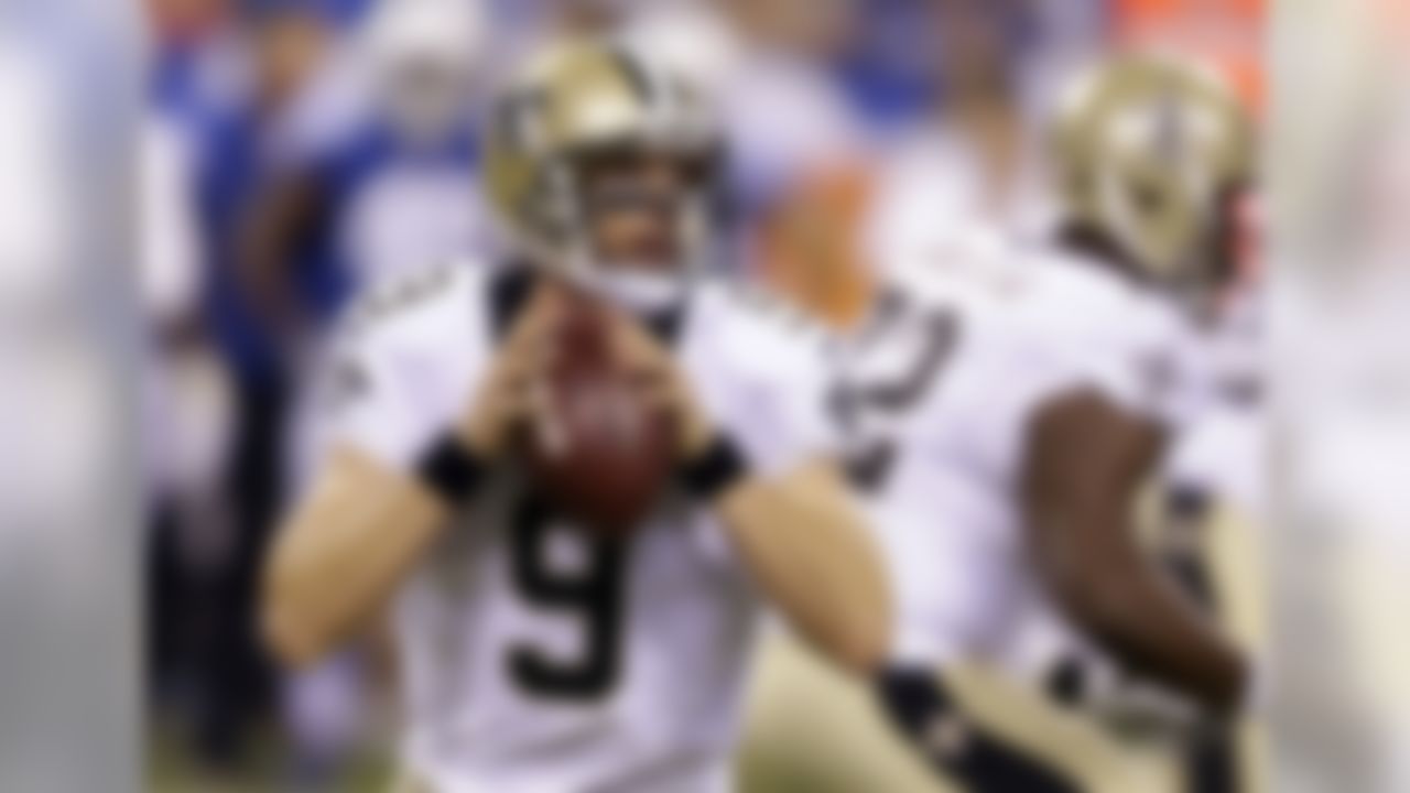New Orleans Saints quarterback Drew Brees looks to throw against the Indianapolis Colts during the first half of an NFL preseason football game in Indianapolis, Saturday, Aug. 23, 2014. (AP Photo/Michael Conroy)