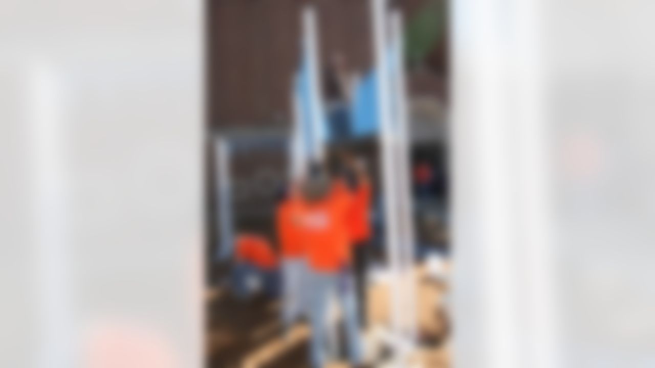 The Home Depot associates working together to put a piece of the playground together. (Photo by Tom Copeland/Home Depot)