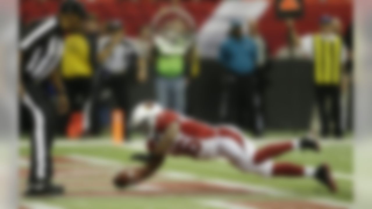 Arizona Cardinals running back LaRod Stephens-Howling (36) leaps into the end zone for a touchdown against the Atlanta Falcons before the first half of an NFL football game Sunday, Nov. 18, 2012, in Atlanta. (AP Photo/David Goldman)