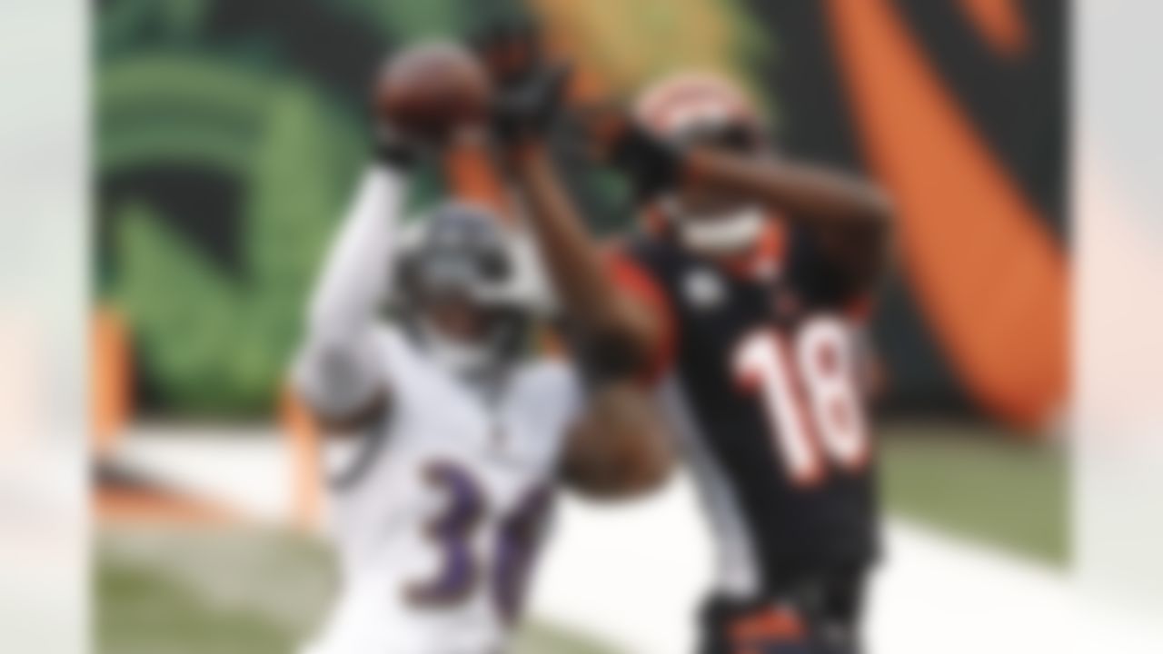 Baltimore Ravens strong safety Chuck Clark (36) breaks up a pass to Cincinnati Bengals wide receiver A.J. Green (18) during the second half of an NFL football game, Sunday, Jan. 3, 2021, in Cincinnati.