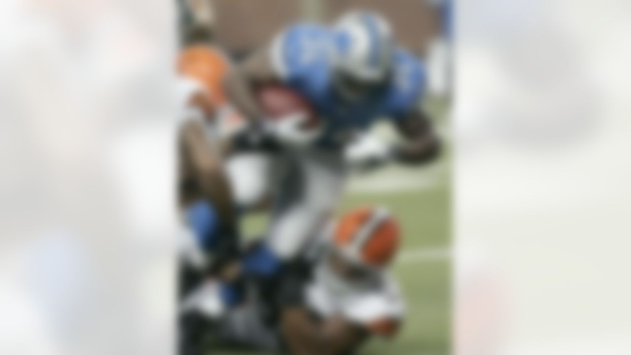 In this Aug. 10, 2012 photo, Detroit Lions running back Keiland Williams (34) scores a  touchdown after a 5-yard run as he is tackled by Cleveland Browns defensive tackle John Hughes (93) in the first quarter of an NFL preseason football game  in Detroit. The  Lions need options in their depleted backfield without Jahvid Best and Mikel Leshoure, and Keiland Williams gives them one as the first preseason game confirmed.(AP Photo/Duane Burleson)