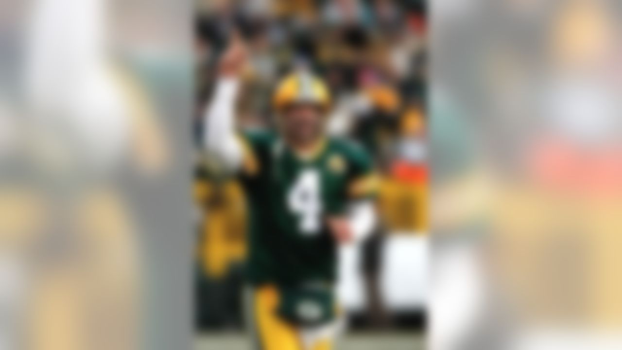 GREEN BAY, WI - DECEMBER 9: Quarterback Brett Favre #4 of the Green Bay Packers celebrates the games first touchdown against the Oakland Raiders at Lambeau Field December 9, 2007 in Green Bay, Wisconsin. The Packers defeated the Raiders 38-7. (Photo by Scott Boehm/Getty Images)