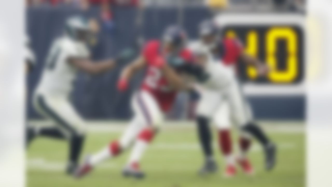 Houston Texans running back Arian Foster (23) runs with the ball as Eagles defender Brandon Boykin (22) tries to tackle during a NFL football game against the Philadelphia Eagles on Sunday November 2, 2014, in Houston. The Eagles beat the Texans 31-21.(AP Photo/Matt Patterson)