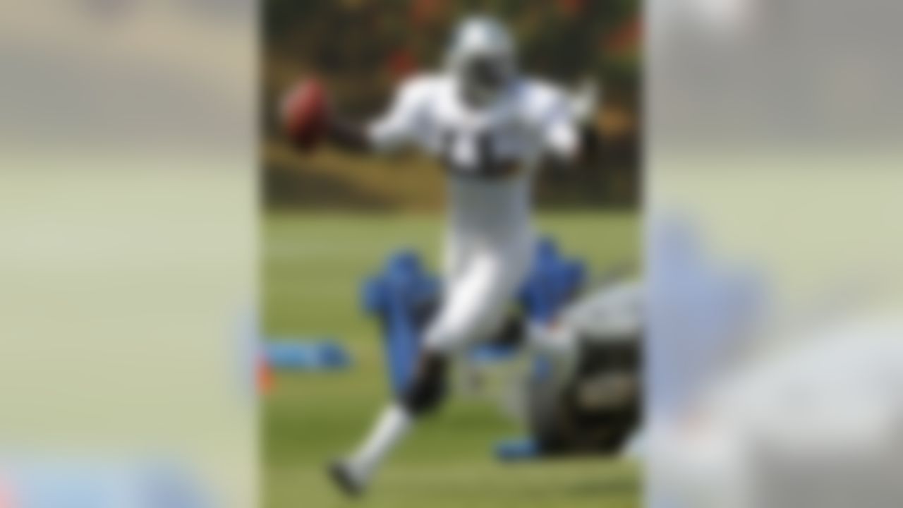 Carolina Panthers' Brandon LaFell celebrates a touchdown catch at the NFL football team's training camp in Spartanburg, S.C., Tuesday, Aug. 9, 2011. (AP Photo/Chuck Burton)