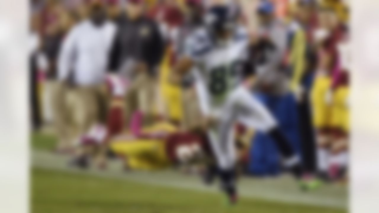 ]Washington Redskins strong safety Bashaud Breeland (26) hangs on to Seattle Seahawks wide receiver Doug Baldwin (89) during the first half of an NFL football game in Landover, Md., Monday, Oct. 6, 2014. (AP Photo/Nick Wass)