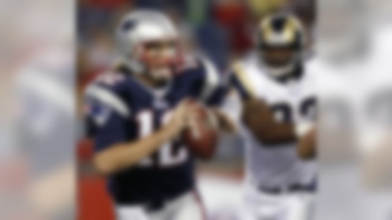 New England Patriots quarterback Tom Brady scrambles away from St. Louis Rams linebacker Bobby Carpenter during the first quarter of an NFL preseason football game in Foxborough, Mass., Thursday, Aug. 26, 2010. (AP Photo/Winslow Townson)