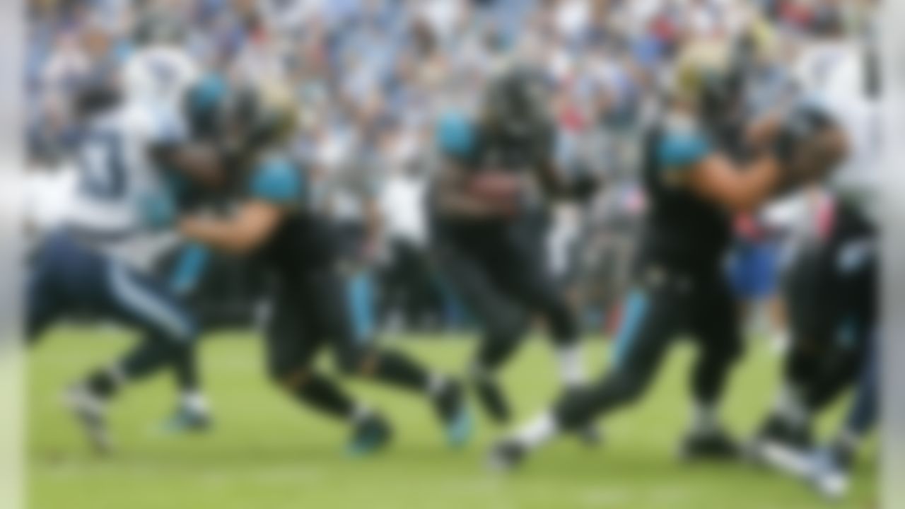 Jacksonville Jaguars running back Storm Johnson (34) scores a touchdown on a 1-yard run against the Tennessee Titans in the first quarter of an NFL football game Sunday, Oct. 12, 2014, in Nashville, Tenn. (AP Photo/Wade Payne)